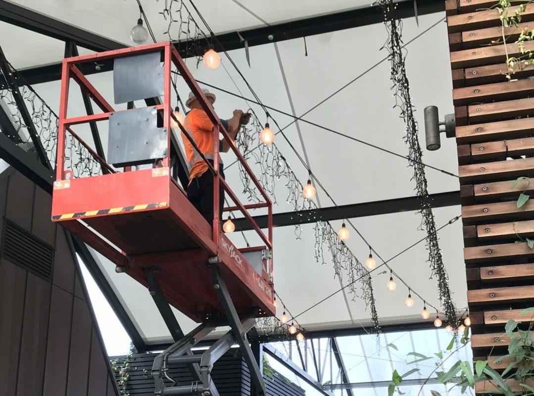 A Deco Led specialist decorating big structures with blue fairy lights
