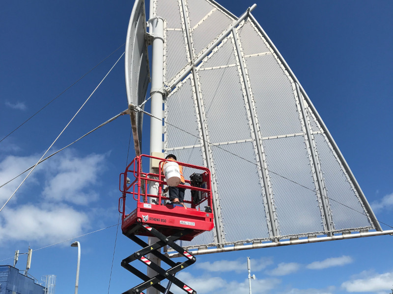 A Deco Led specialist decorating big structures with blue fairy lights